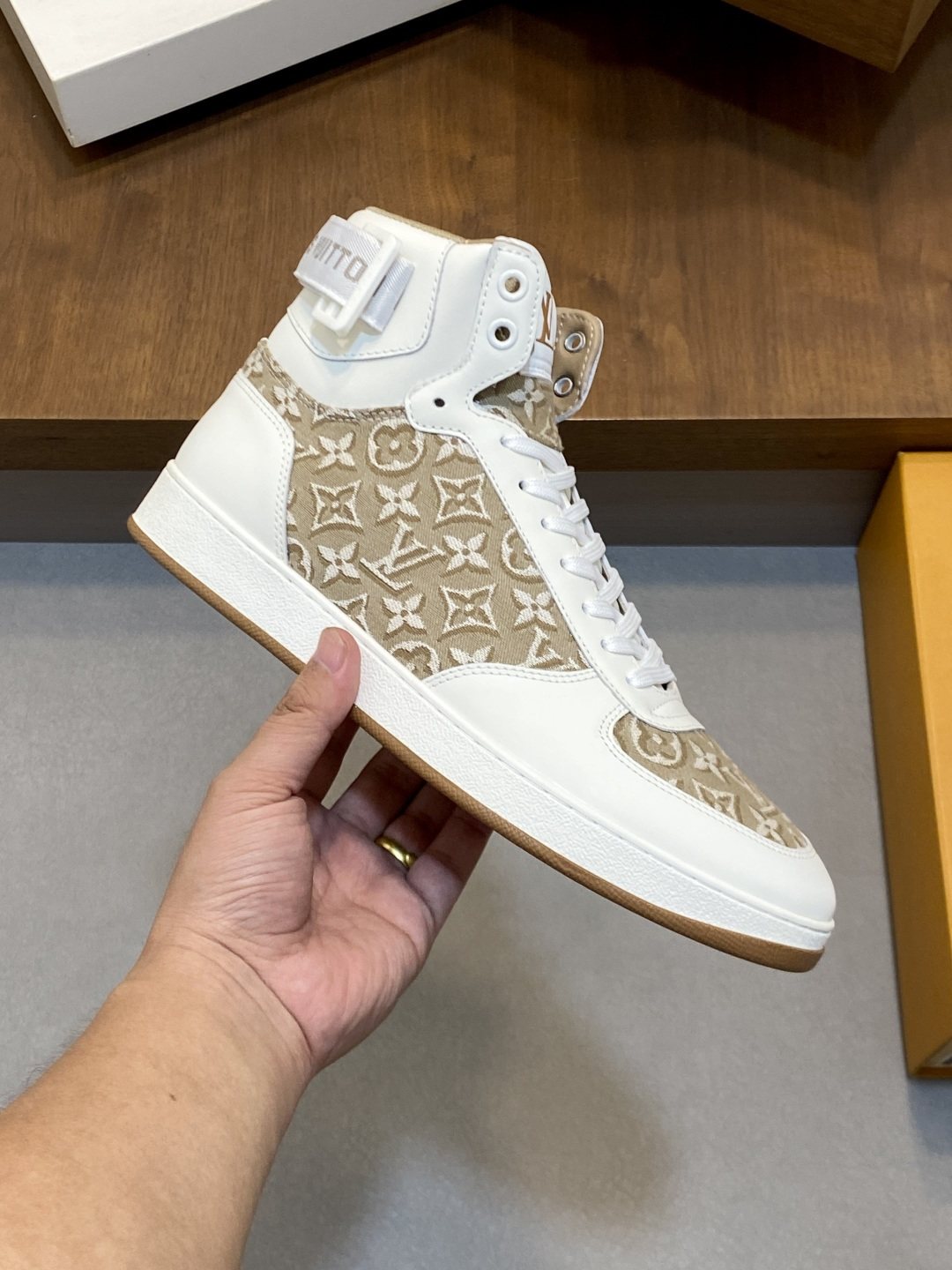 Louis Vuitton Rivoli Patterned High-Top Sneakers — model