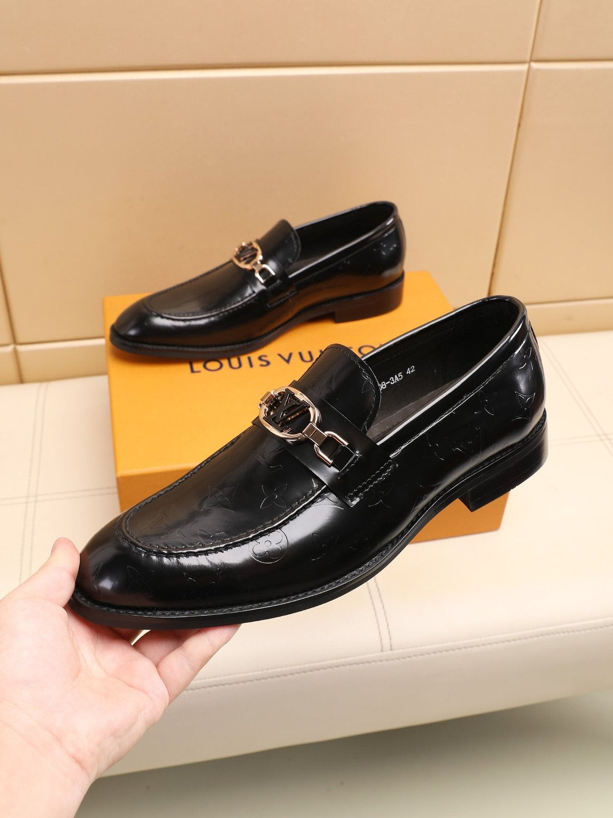 Louis Vuitton Embossed Bit Loafers — front
